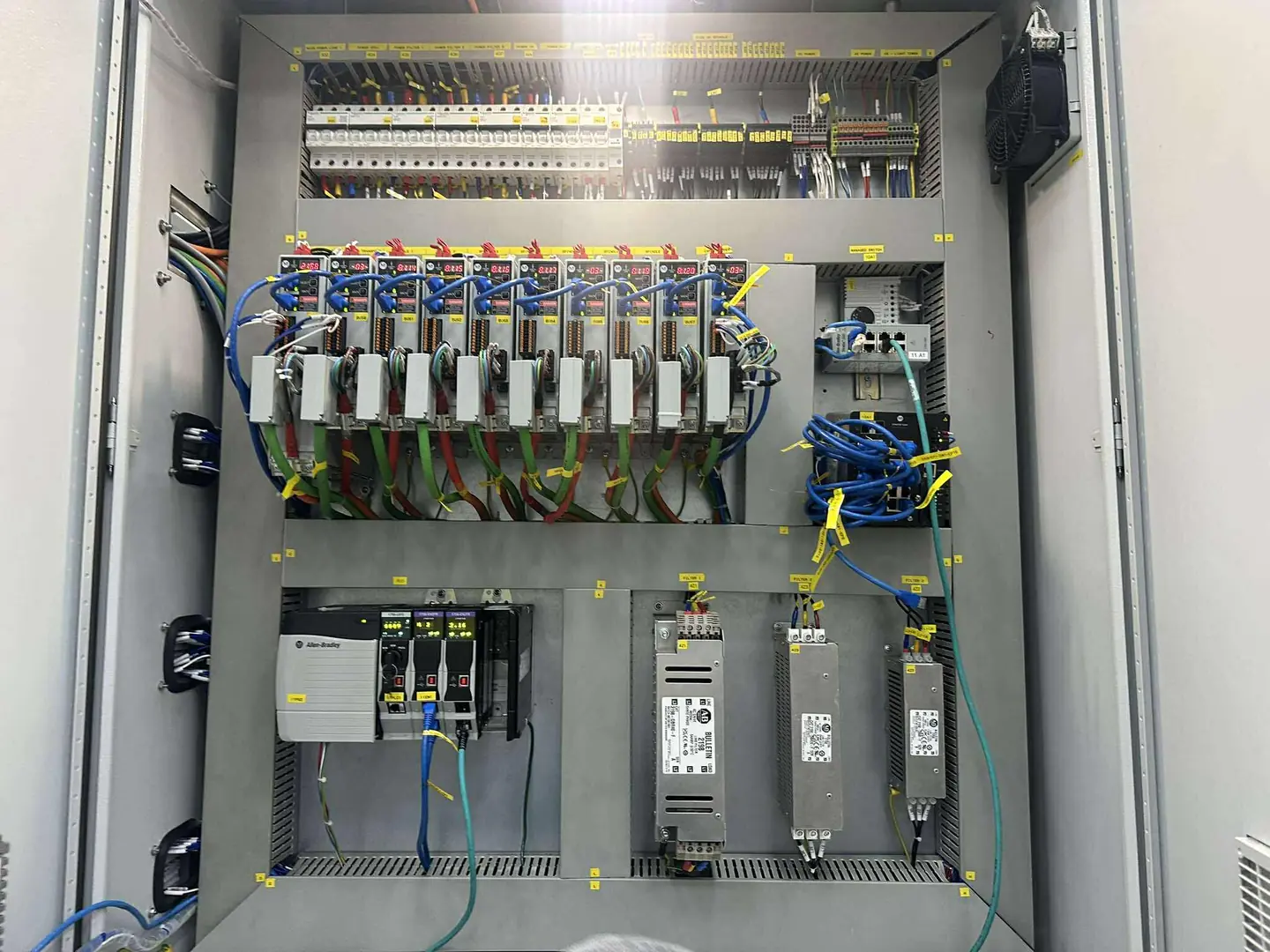 Capper lane control panel: a row of Kinetix 5300 servo drives above the ControlLogix 5580 chassis