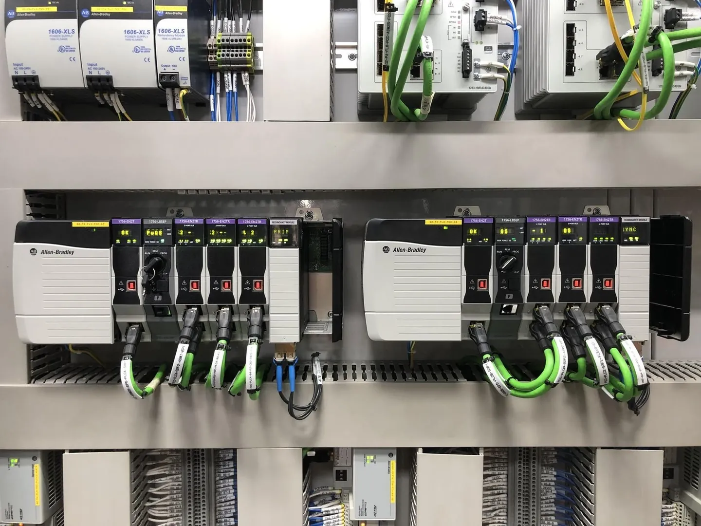 Redundant ControlLogix 5580 chassis pair with EtherNet/IP modules and Stratix switches in the process control cabinet